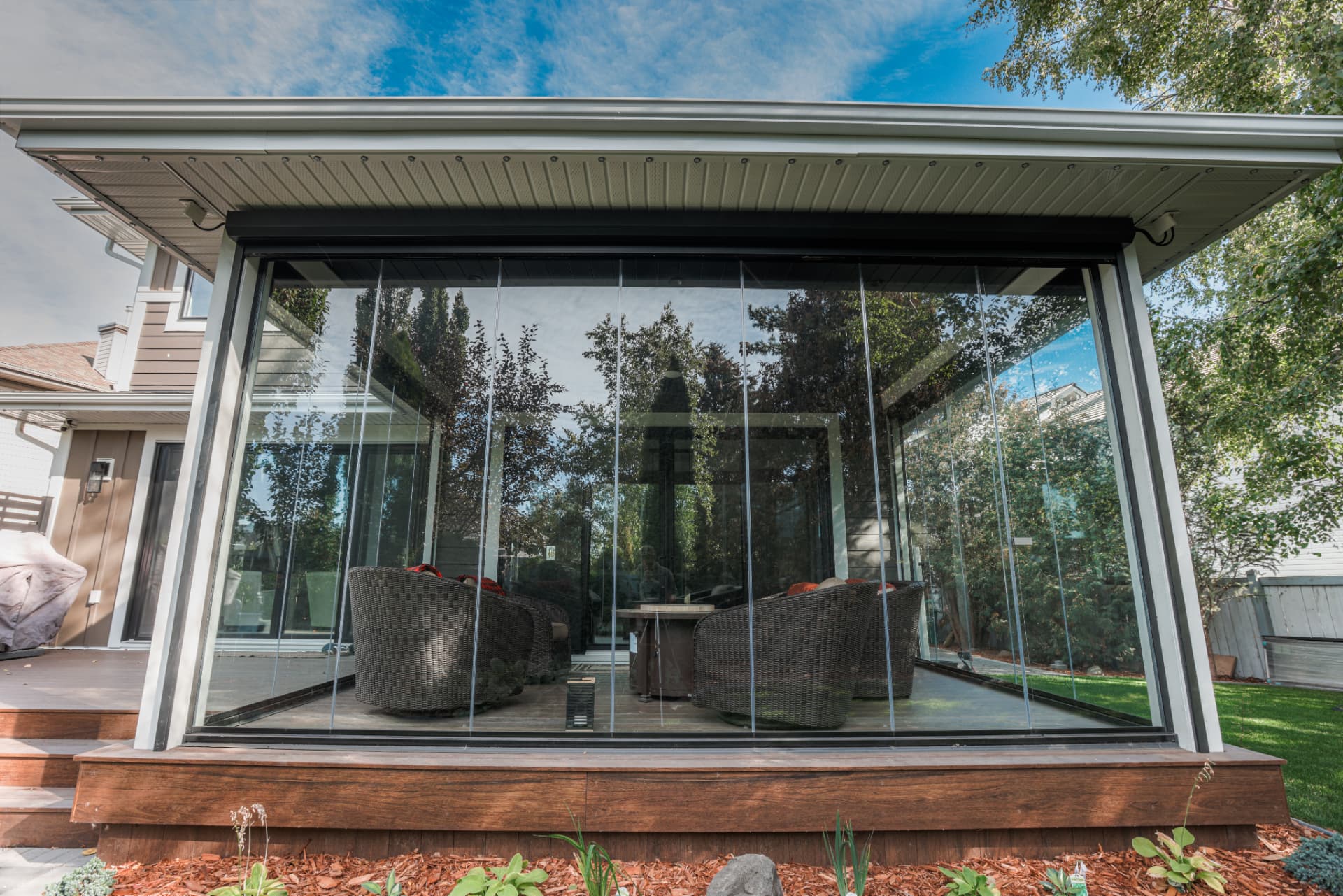 Bright sunroom with floor-to-ceiling glazing